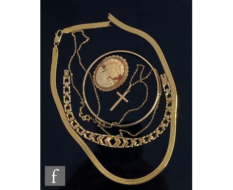 A small parcel lot of assorted 9ct jewellery to include a solid bangle, a cross and chain, a bracelet, a cameo brooch and a b