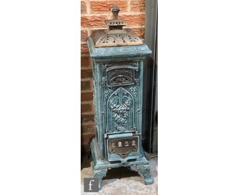 A French light blue enamelled floorstanding cast iron stove with cover, on bracket feet, height 104cm. 