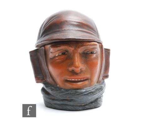 An early 20th Century novelty tobacco jar and cover modelled as Charles Lindenberg, height 14cm. 