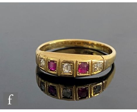 An early 20th Century 18ct ruby and diamond five stone boat shaped ring, weight 3.4g, ring size O. 