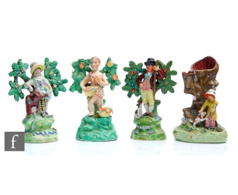 Three 19th Century Staffordshire Walton bocage figures comprising a pair of gardeners, she holding a watering can, he stood w