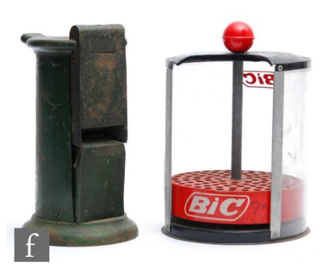 A Edmondson green painted railway ticket dating press machine, height 25cm, and an early BIC pen dispenser, height 27cm. (2) 