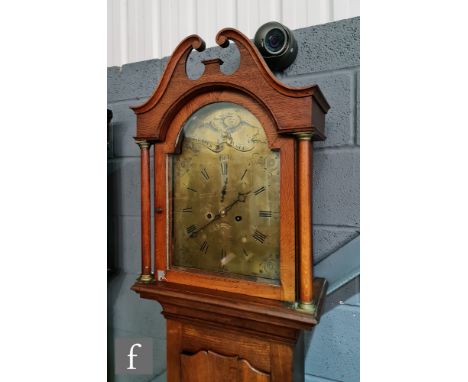 A 19th Century mahogany longcase clock, with later associated broken arch brass dial engraved with an eagle and banner titled