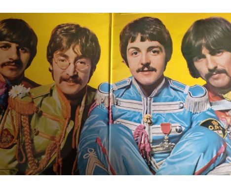 The Beatles vinyl LP including"White Album" (gatefold with four postcards and a fold-out poster. Numbered 0149372), "Rubber S
