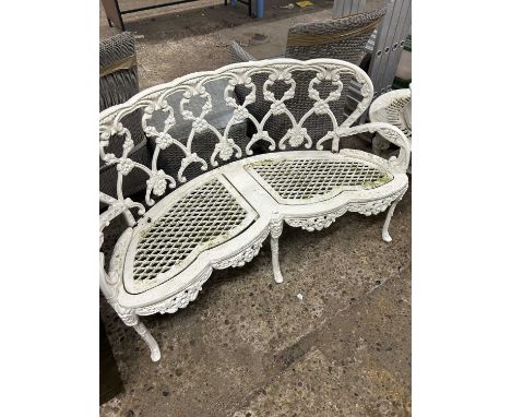 A cast metal garden bench