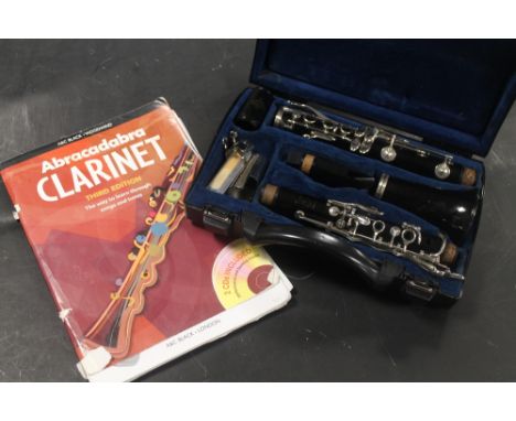 A CASED BOOSEY AND HAWKES CLARINET AND INSTRUCTIONS