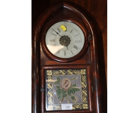 AN ANTIQUE MANTEL CLOCK