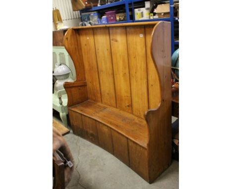 19th century Pine Barrel Back Settle with Panelled Back and Shaped Wing Arms, the Solid Seat with Cut-Out Panel opening to st