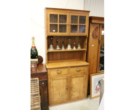 Vintage Pine Dresser, the top with Two Glazed Doors over and Open Shelf, the base with Two Drawers over Two Cupboards, 96cms 