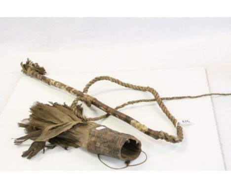 African phallic sheath with whip 