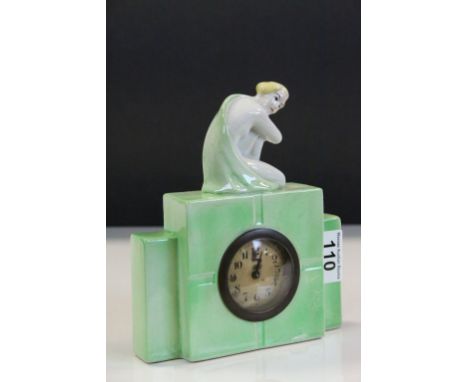 Art Deco Ceramic Clock surmounted by a Semi Naked Lady