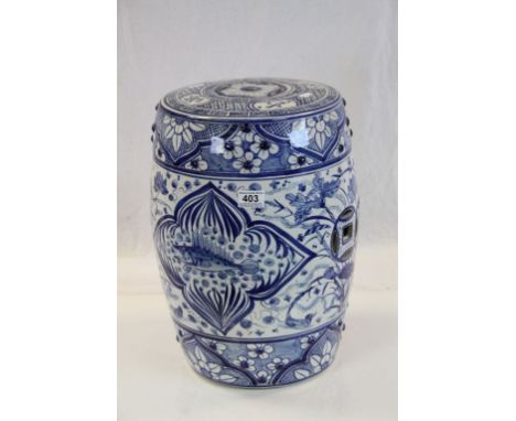 Oriental blue and white ceramic seat with stylised fish and floral decoration 