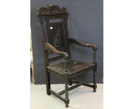 19th century Dark Oak Wainscot Style Chair, the panel back carved with a Green Man Mask