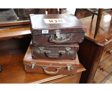 Three assorted vintage child's travelling cases