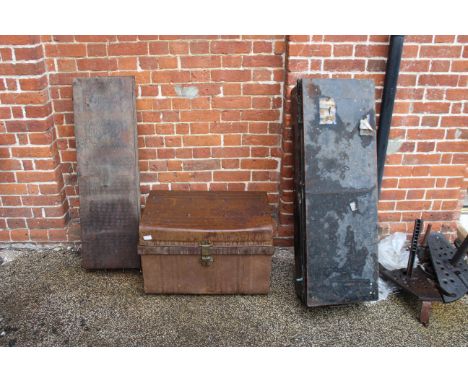 Three vintage metal storage trunks