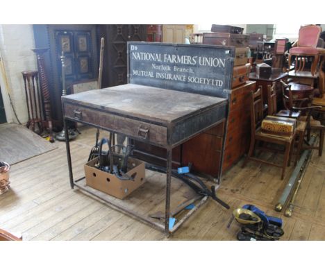 A vintage metal and wooden one drawer work table with sign for National Farmers Union to upstand