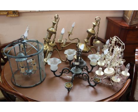 A pair of brass six branch candelabra with a pair of painted five branch candelabra with glass drops, a five branch candelabr