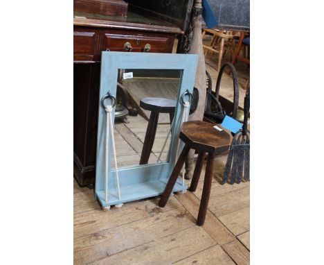 A vintage oak milking stool together with a painted mirror