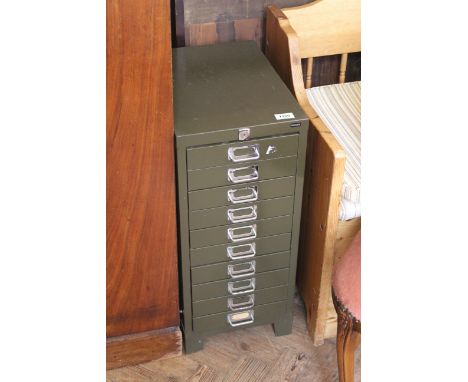 A vintage metal bank of ten drawers