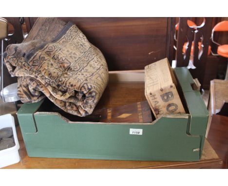 A wall hanging carpet with a vintage Bovril box together with two 19th Century boxes