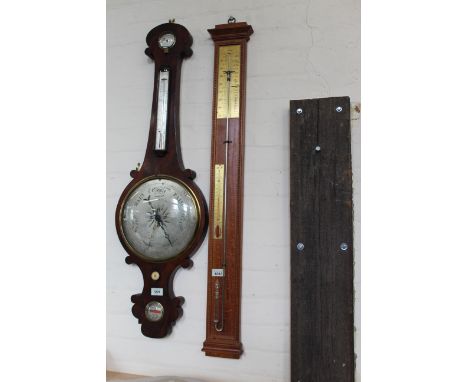 A 20th Century stick barometer with brass scale and thermometer