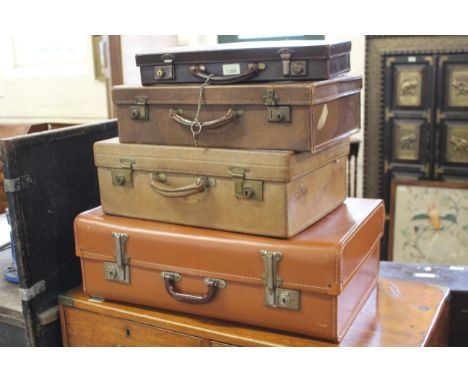 Four vintage suitcases