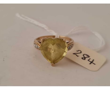 A heart shape ring with diamond shoulders set in gold size O  