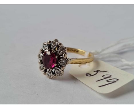 A ruby and diamond cluster ring 18ct gold size O    3.6 gms