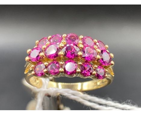 A three row ruby dress ring 9ct