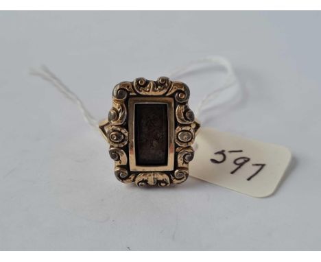 A antique memorial ring with gold shank and locket top size N   