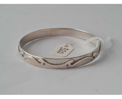 A hallmarked fancy design silver bangle   22 gms