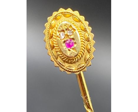 A Victorian ruby and diamond stick pin finely decorated 15ct gold