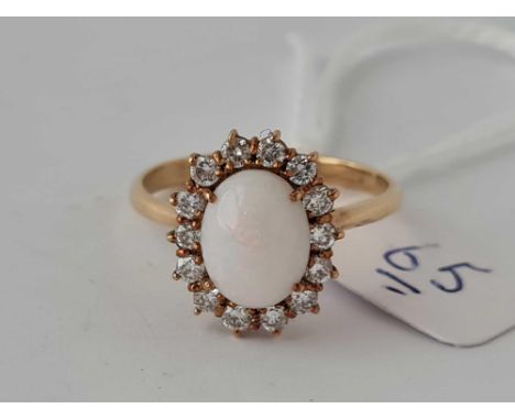 An opal and diamond cluster ring in 18ct gold size T 4.4g