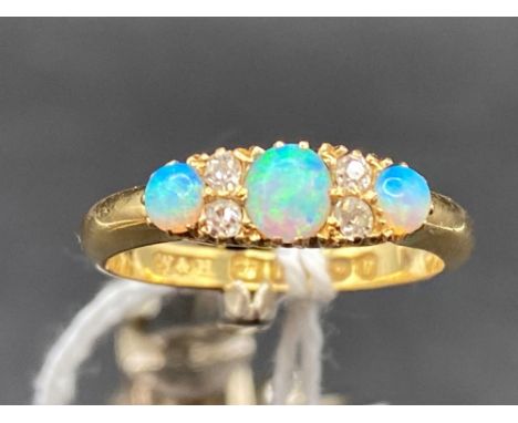 A EXCELLENT 19TH CENTURY THREE STONE OPAL AND DIAMOND RING