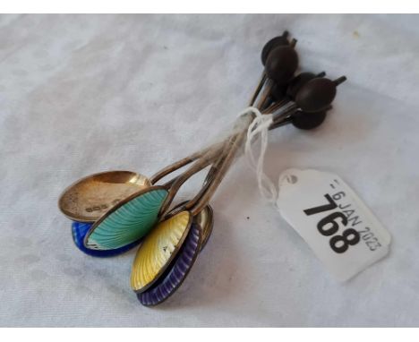 Group of six silver gilt and enamel decorated bean topped spoons