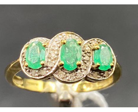 A emerald and diamond triple cluster ring 9ct