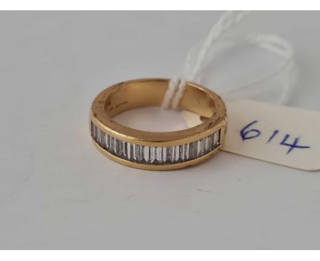 A BAGUETTE DIAMOND SET RING 18CT GOLD SIZE K    5.3 GMS