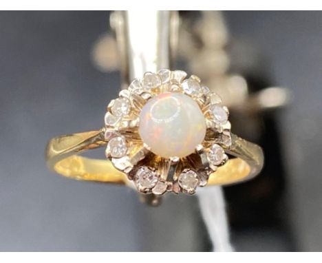 A opal and diamond daisy head cluster ring 18ct