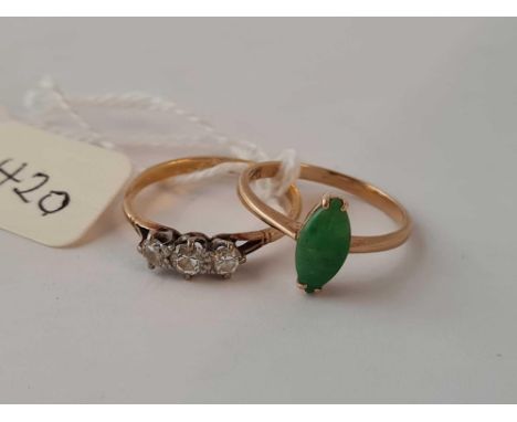 A diamond three stone ring size O and a jade ring size N both 18ct gold      4 gms inc