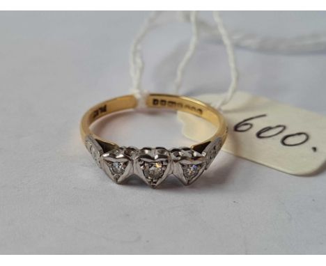 A three stone diamond ring in heart setting 18ct gold size N    2.4 gms