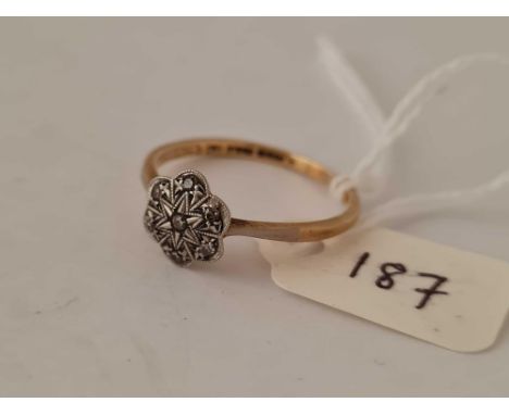 A diamond cluster ring 18ct gold size R    2.6 gms