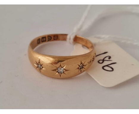 A three stone diamond gypsy set ring 18ct gold size N    3.9 gms
