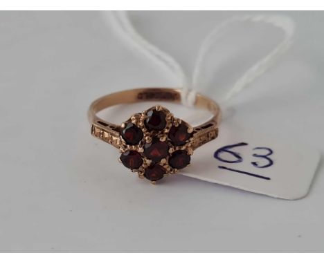 A vintage garnet cluster ring in 9ct size O
