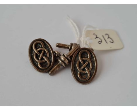 A pair oval Celtic design silver cufflinks