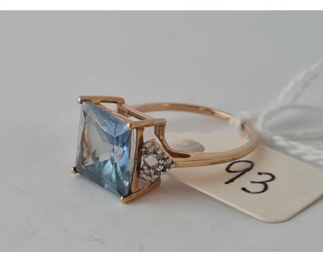 A blue stone ring with diamond shoulders size O    