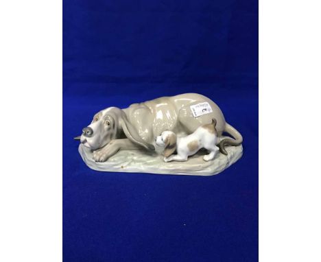 NAO FIGURE GROUP OF DOGS AND A LLADRO FIGURE GROUP OF ELEPHANTS