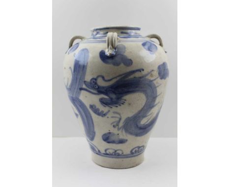 A CHINESE SWATOW OR ZHANGZHOU WARE GLAZED BLUE PAINTED CERAMIC VASE, strap work handles to the shoulders, this type of ware w
