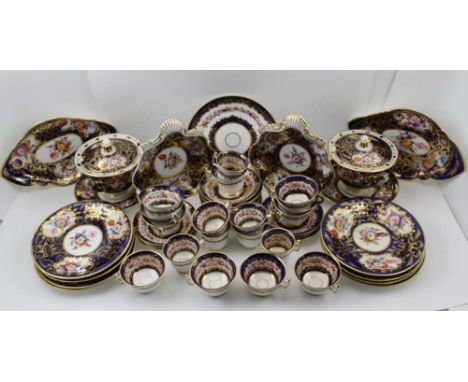 A 19TH CENTURY PORCELAIN PART TEA & DESSERT SERVICE, gilded cobalt blue borders with hand painted floral decoration, consider