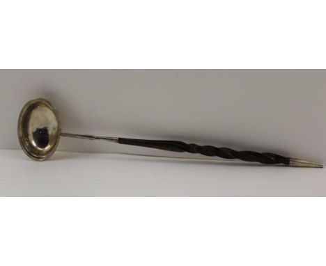 A GEORGE III SILVER LADLE, fitted a twisted whale bone handle, indistinct hallmarks, 33.5cm long 
