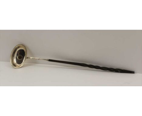 A GEORGIAN LADLE, white metal bowl inset a George III coin, dated 1798, fitted a twist whale bone handle, 37cm long 